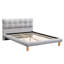 Confortable lit double gris avec tête de lit distinctive en forme de biscuit et structure stable en chenille