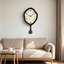 Horloges murales noires à pendule irrégulière