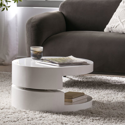 Table basse pivotante contemporaine, petite, avec rangement dissimulé, fini blanc lustré, 60 x 60 x 33 cm. Table pivotante avec compartiment de rangement secret et plateau blanc, 60 x 60 x 32 cm.