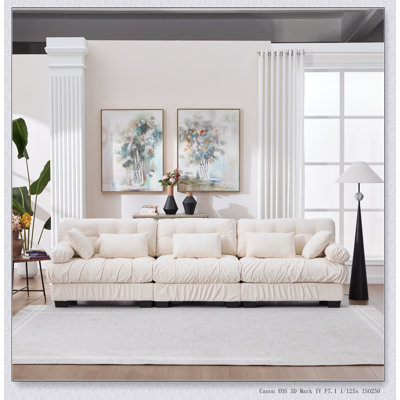 Canapé d'angle modulaire, modèle Cloud avec assise profonde et 5 coussins décoratifs, idéal pour les salons et les chambres modernes.