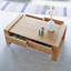 Nasrine Solid Wood Sled Coffee Table