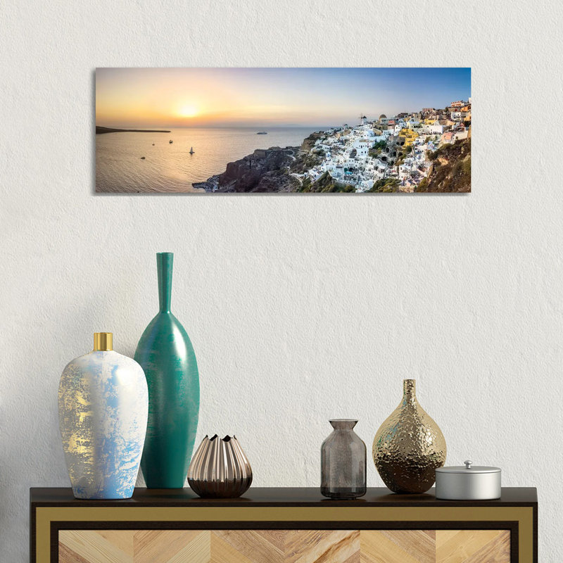 Panoramic Sunset View Of Oia And The Caldera, Santorini, Greece by Jan Becke - Wrapped Canvas Panoramic Print