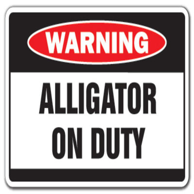 Enseigne d’avertissement en forme d’alligator
