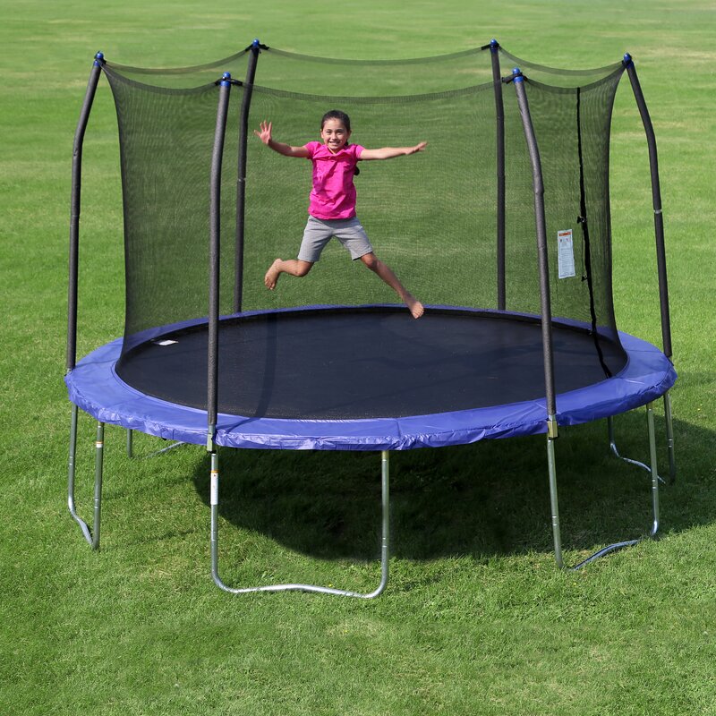 A child jumping on a Skywalker 12 ft Round Trampoline. 