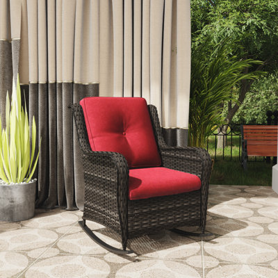 Outdoor Spencerian Rocking Wicker/Rattan Chair with Cushions by Red Barrel Studio
