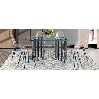Ensemble de table et de chaises Table de salle à manger ovale en verre trempé de 71 pouces à double colonne noire de style luxueux. Jumelé avec 6 chaises en plastique transparent avec des pieds en métal noir.