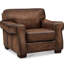 Fauteuil Capri en cuir pleine fleur ciré, dossier capitonné et garniture cloutée
