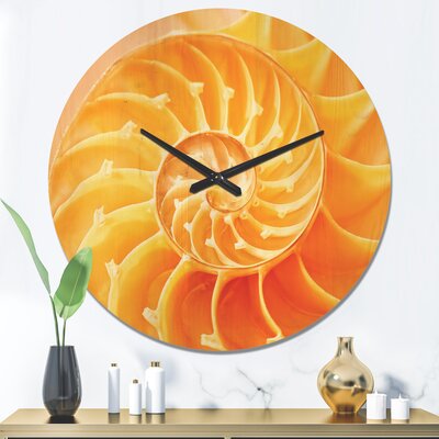 Yellow Nautilus Shell - Modern Wood Wall Clock -  East Urban Home, 34CE7AA5B8B148E2A3CEE8326A6AFFE8