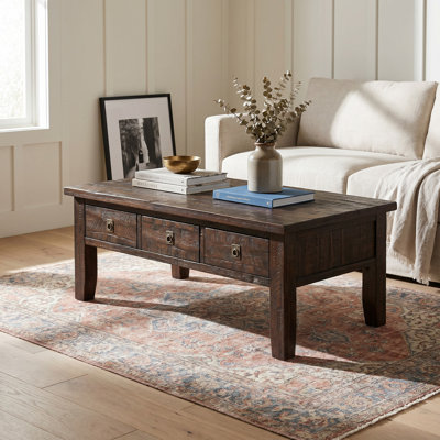 Table basse avec rangement en bois massif à 4 pieds Mariama