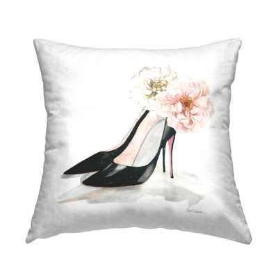 Coussin décoratif à imprimé floral rose avec talons noirs