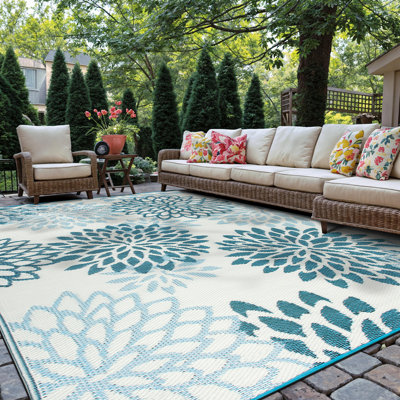 Ramveer Floral Blue/Ivory Reversible Indoor/Outdoor Plastic Straw Area Rug