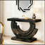 Console de luxe moderne avec base en demi-lune miroir et finitions glamour effet diamant.