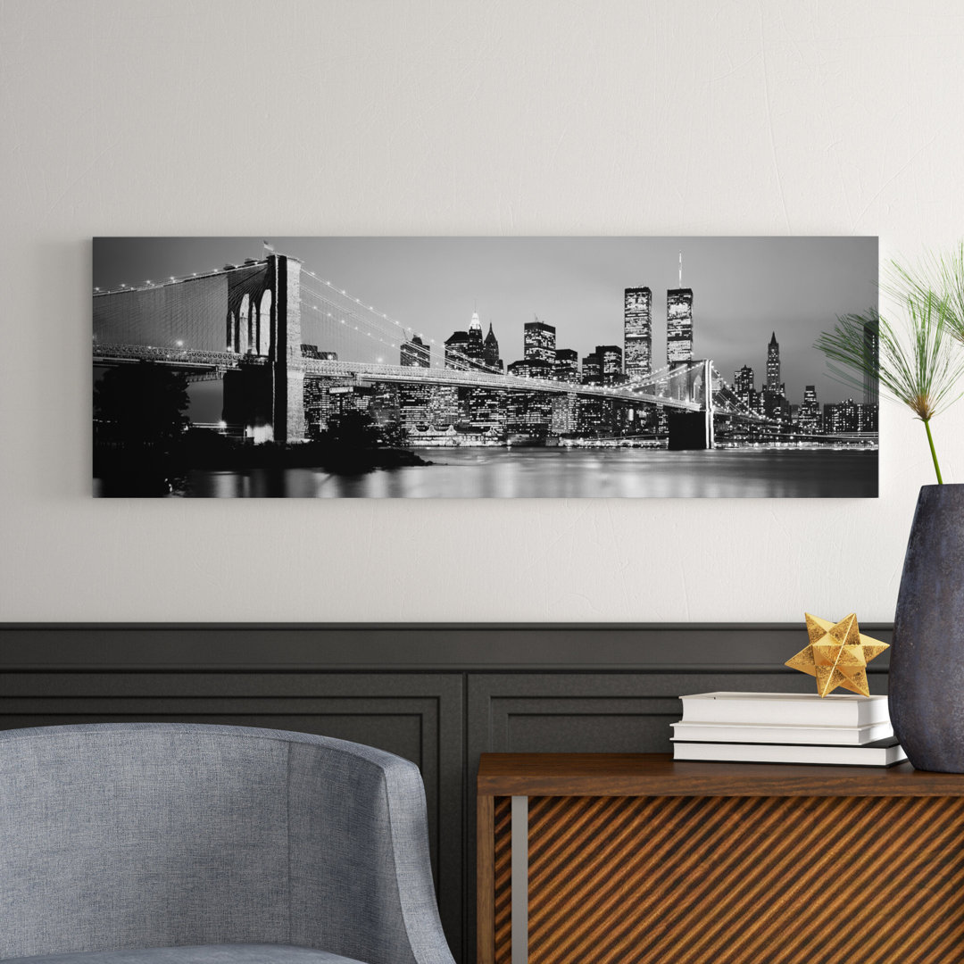 Illuminated Brooklyn Bridge With Lower Manhattan's Financial District Skyline In The Background In B&W, New York City, New York by Panoramic Images -