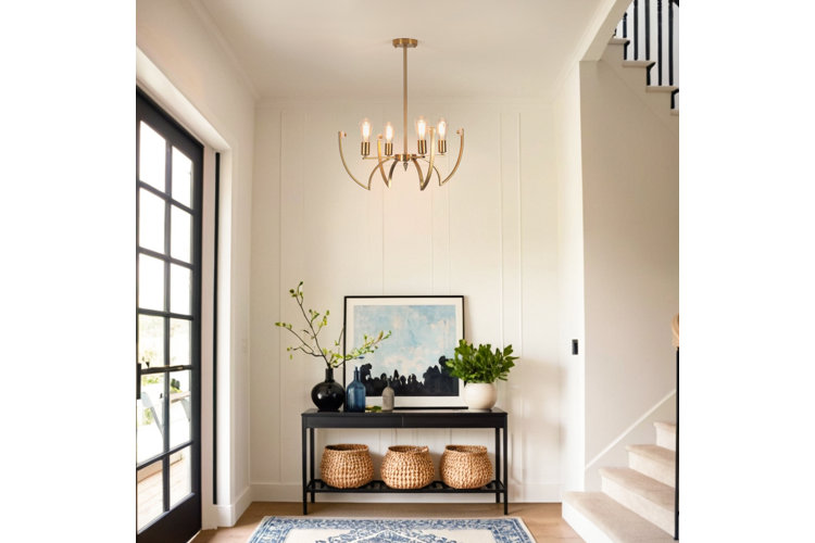 tall transitional entryway with a gold chandelier