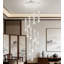 Lustre en spirale moderne avec design en forme de goutte de cristal, éclairage à DEL à intensité variable pour plafonds hauts, luminaire d'escalier à hauteur réglable avec télécommande