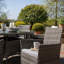 Dubose 4 - Person Wicker Patio Dining Set with Round Table , Cushions Included-969686495