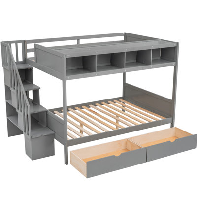 Lit simple superposé au dessus d'un lit double, gris avec tablettes, escalier et 2 tiroirs. Répondez aux exigences des chambres à coucher modernes