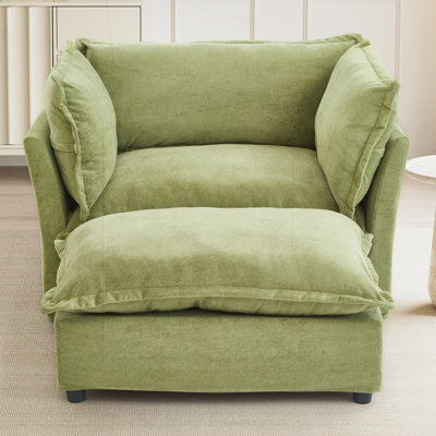 Fauteuil moderne avec repose-pieds mobile, siège large, accoudoirs courbés et coussins moelleux pour un confort et un style ultimes dans n'importe quelle pièce
