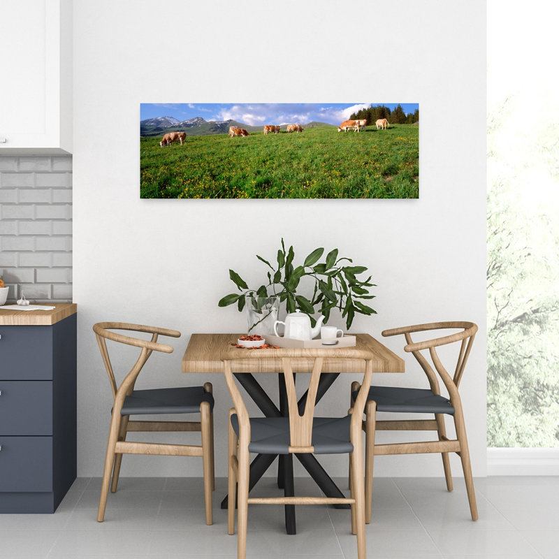 Switzerland Cows Grazing In The Field by Bo Brännhage - Wrapped Canvas Panoramic Print, 30.48 cm H x 91.44 cm W