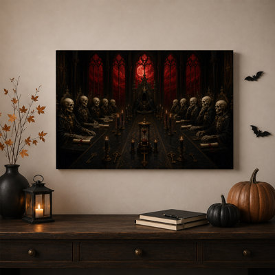 Squelettes gothiques assis à une longue table avec une toile rouge d'Halloween