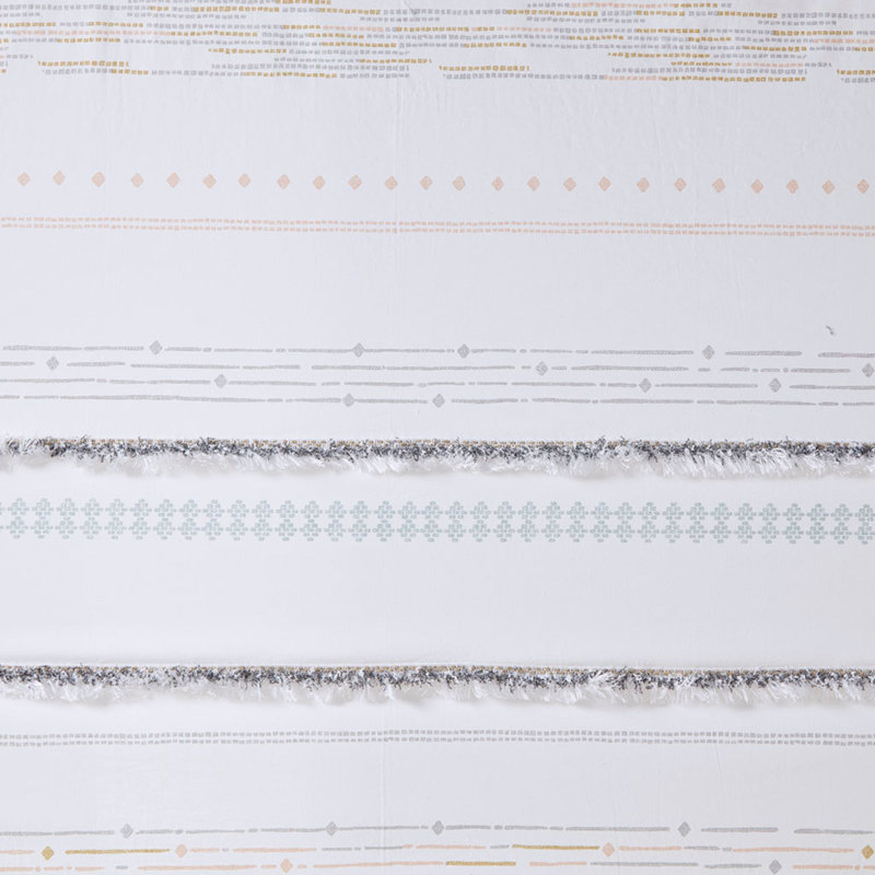 Rideau de douche en coton avec pompons et rayures, parfait pour les salles de bain de style bohème et facile d'entretien