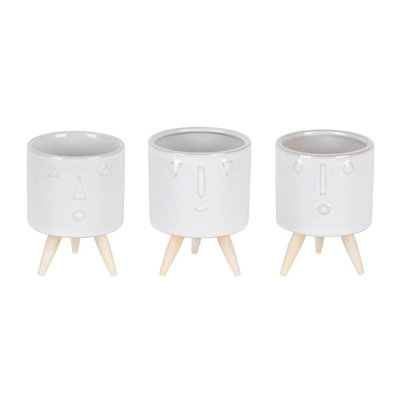 Set of Three White Porcelain 1 Ounce Round Funny Face Pot Planters With Stands
