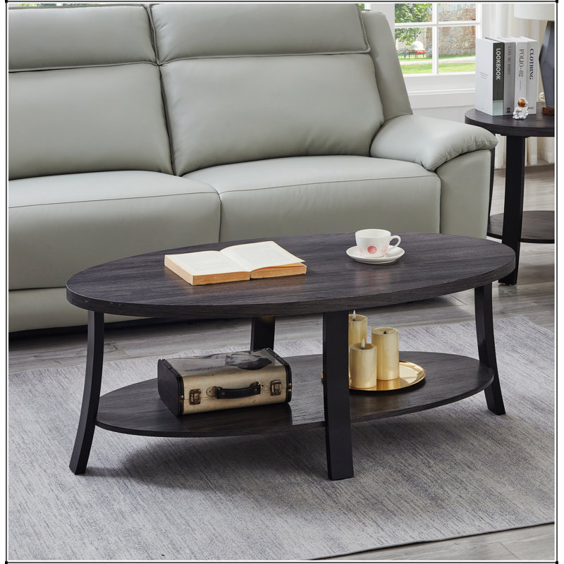 Table basse ovale contemporaine Anze avec tablette en bois, placage durable et espace de rangement supplémentaire, idéale pour les espaces de vie modernes.