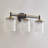 Harlune 3-light 23.25’’l Vanity Light Black And Gold Finish With Textured Glass Shade