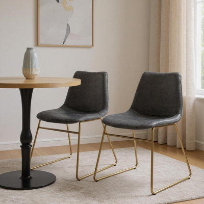 Ensemble de deux chaises d'appoint en velours vert et or et métal