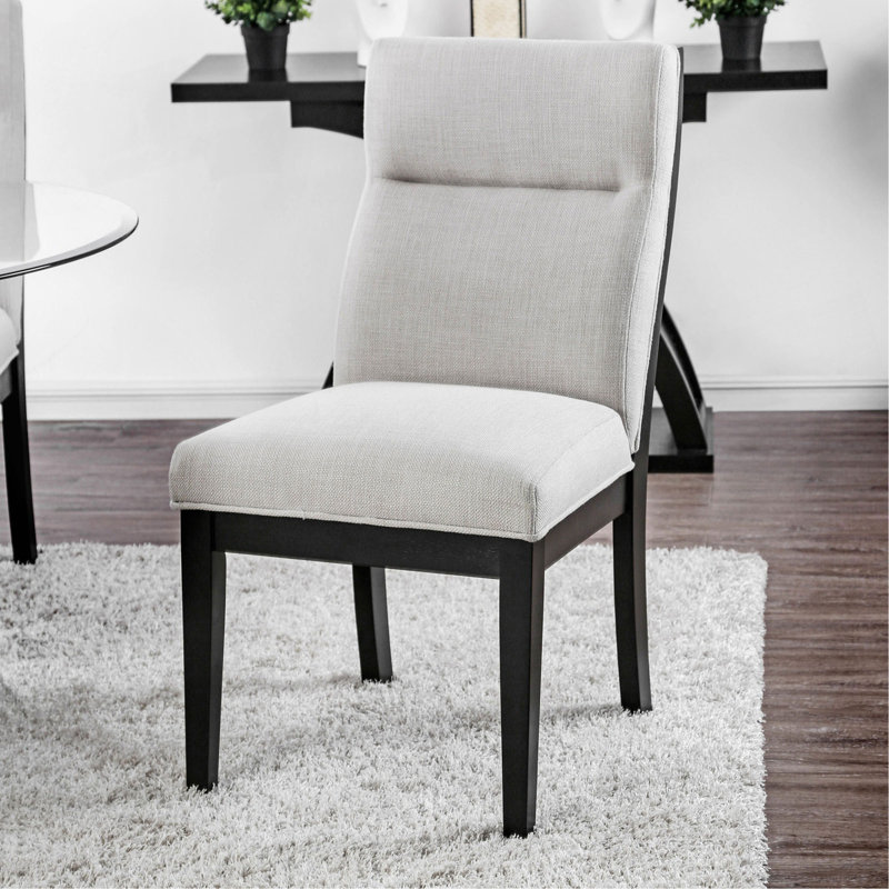 Ensemble de 2 chaises modernes à finition bicolore beige et noire avec pieds fuselés et coussins rembourrés en similicuir
