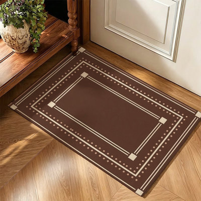 Tapis décoratif géométrique traditionnel à bordure brun foncé, 119 cm x 79 cm