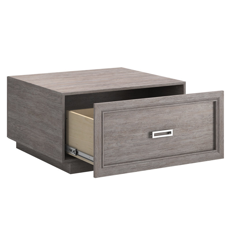 Table basse grise avec tiroir coulissant lisse et tablette ouverte, design moderne pour les salons, gris moyen compact avec un rangement spacieux, ajout élégant aux espaces, simple