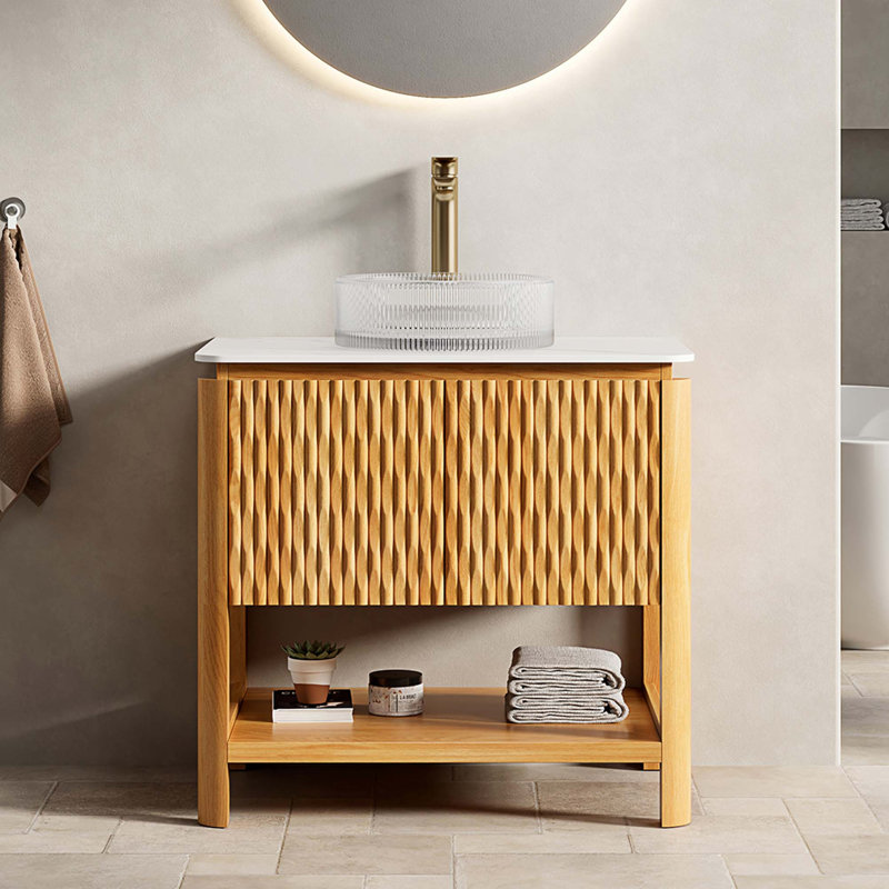Meuble-lavabo autoportant avec plateau en pierre frittée et lavabo en verre
