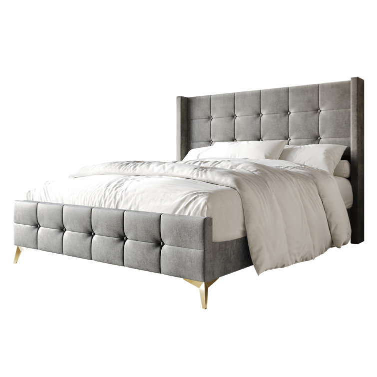 Karmane Upholstered Wingback Bed