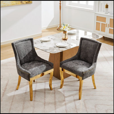 Chaises de salle à manger rembourrées en chenille avec pieds courbés de couleur dorée et détail de rivet