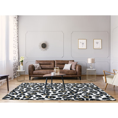 Tapis blanc / noir / beige à imprimé animal