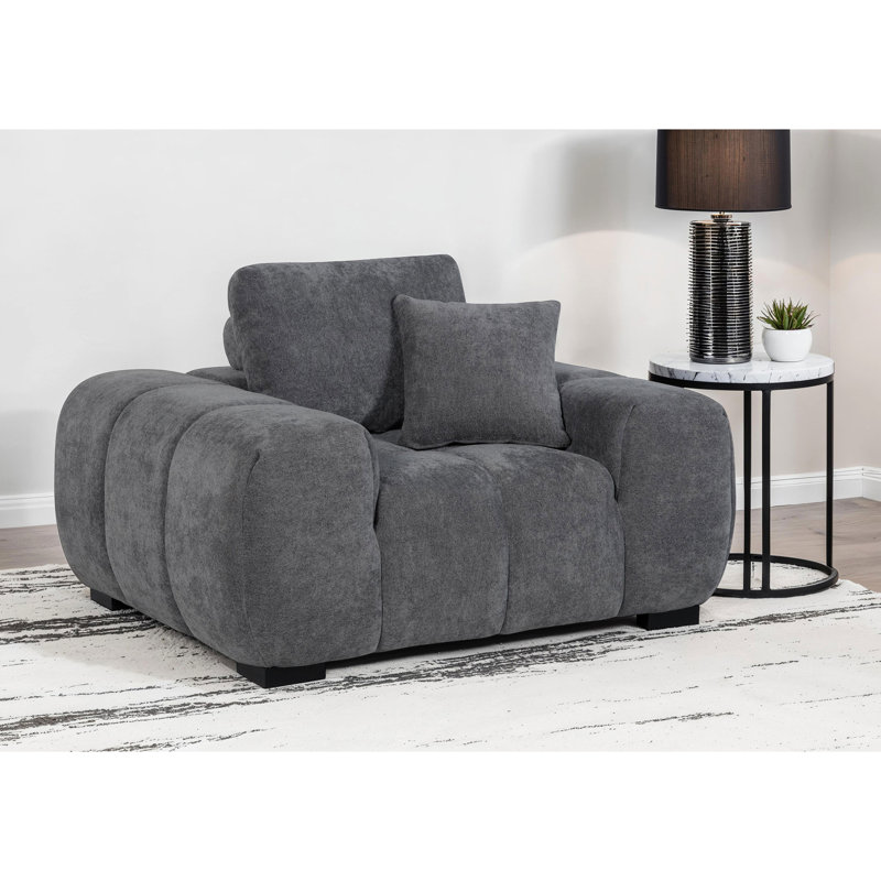 Fauteuil d'appoint gris anthracite gris anthracite avec capitonnage à canaux verticaux profonds et siège confortable pour une détente à long terme. Siège large rembourré