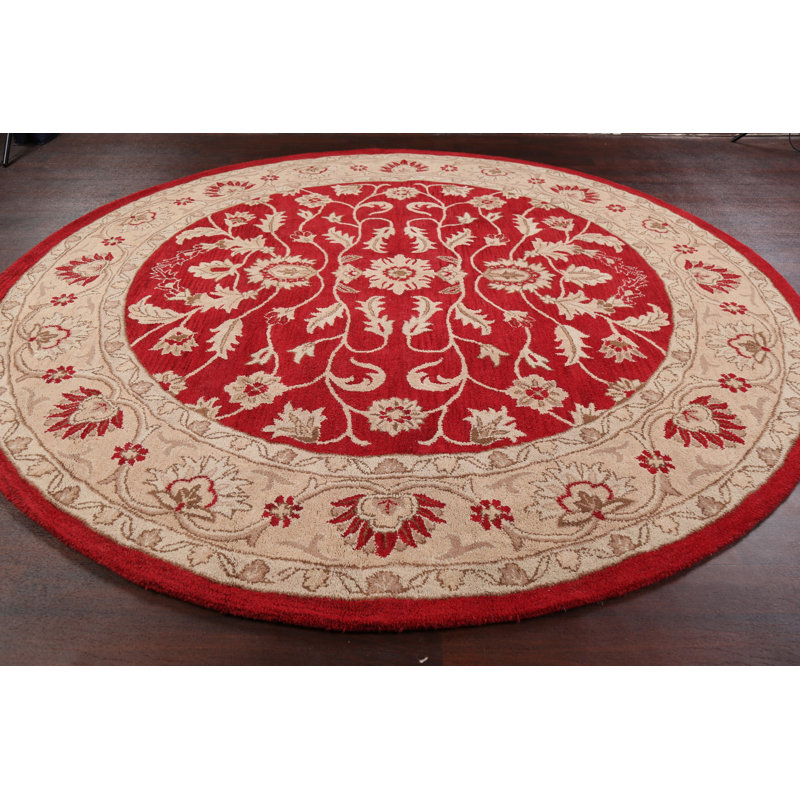 Tapis rond rouge / beige en laine touffeté à la main