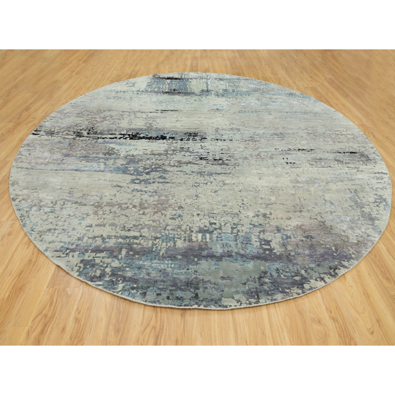 Tapis décoratif circulaire de noué à la main 12 pi en gris/bleu de conception unique chanie