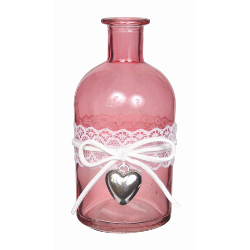 Vase rose avec ruban blanc