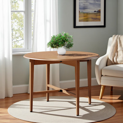 Jaclin Light Oak Double Drop Leaf Round Dining Table by Lark Manor