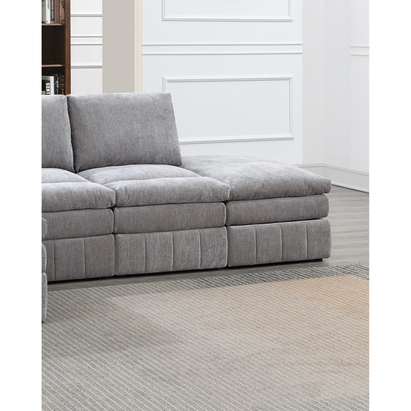Canapé d'angle modulaire de 5 pièces en suède pour un espace de vie confortable et élégant. Tissu d'ameublement.