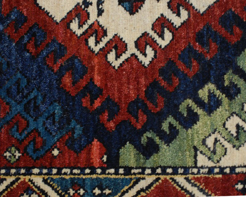 Bordjalu Wool Southwestern Area Rug in Green/Red