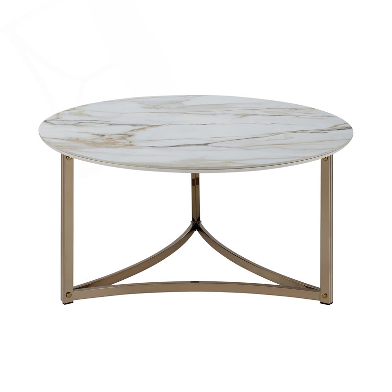 Table basse ronde avec plateau en pierre frittée et structure en métal champagne