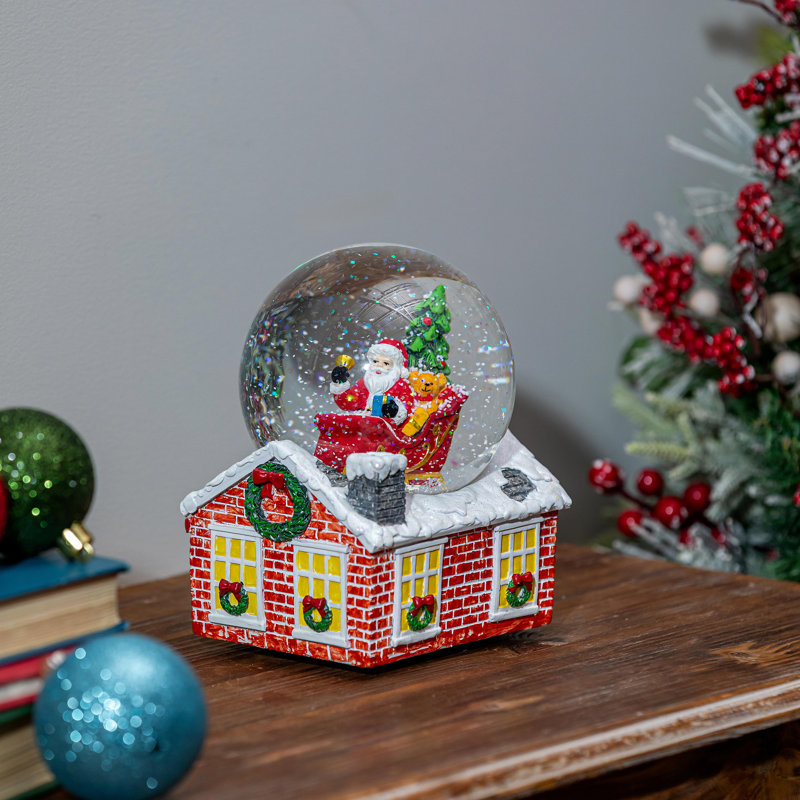 Globe terrestre en résine Père Noël en traîneau avec base maison