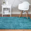 Tapis en polypropylène tissé à la machine à poils longs de couleur unie turquoise Fragos-1063882302