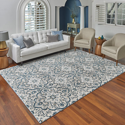 Tapis à médaillon à volutes gris / bleu Mickelson