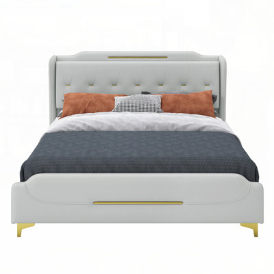 Luxurious Leather Upholstered Platform Bed with Gold Metal Accents, Combining Modern Design and Ultimate Comfort for Your Bedroom.