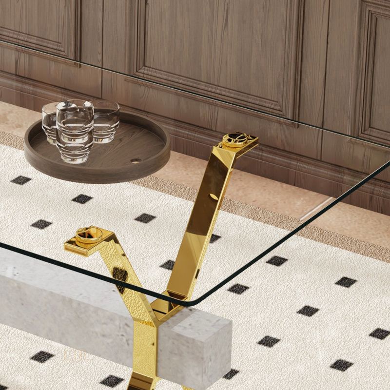 Table de salle à manger moderne en verre trempé avec pieds plaqués or et barres transversales en bois aggloméré gris, idéale pour la maison et le bureau