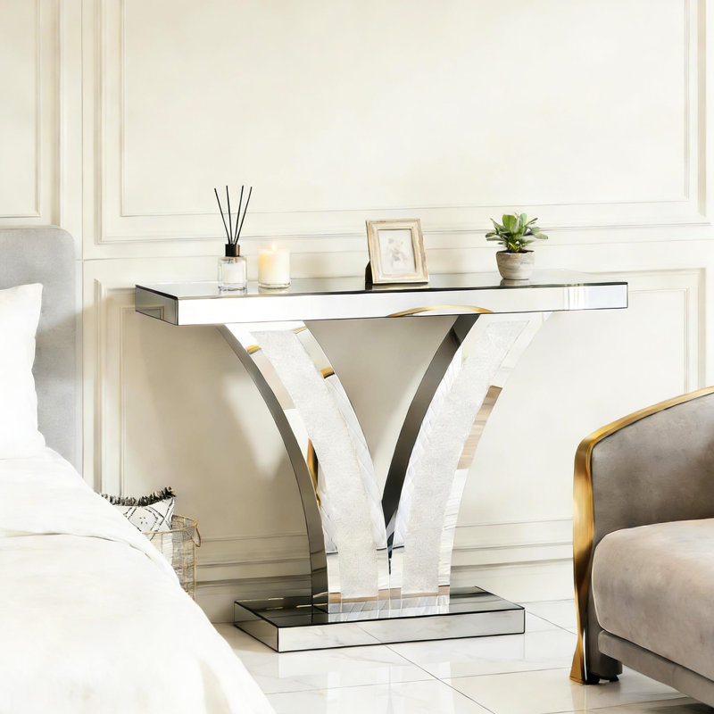 Console scintillante en forme de V avec effet miroir, stable et facile à installer, idéale pour les espaces de vie et les entrées. Dimensions : profondeur 100,3 cm, largeur 29,3 cm, hauteur 80,2 cm. Base stable.